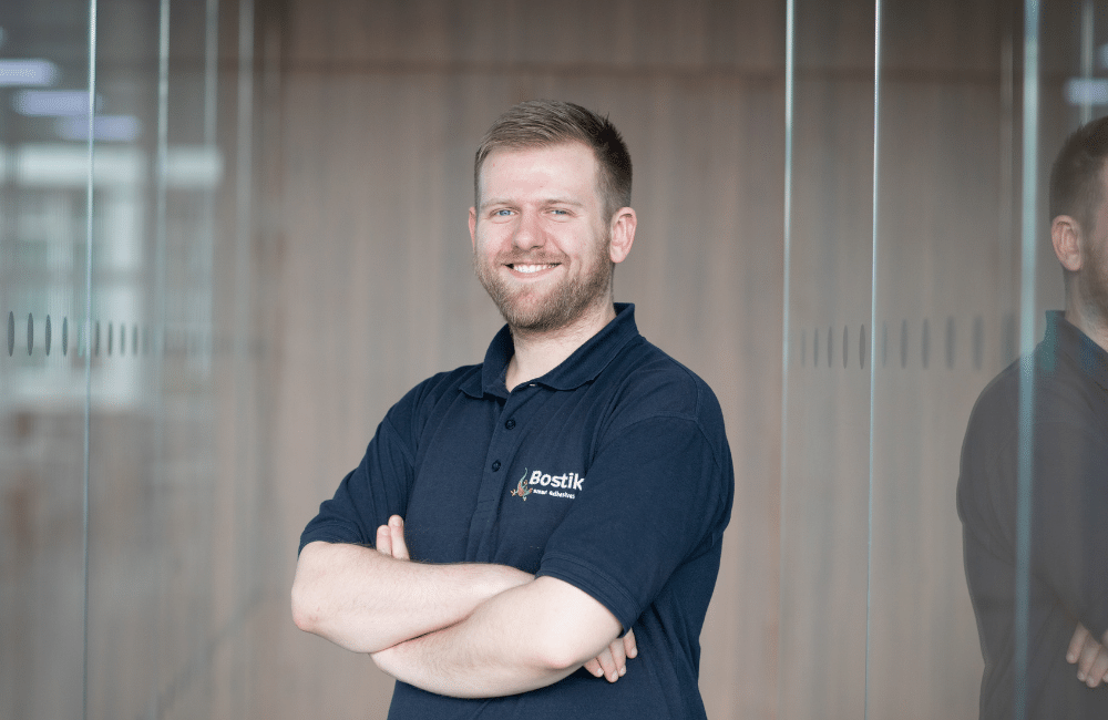 image of Adam Jones, technical sales consultant at Bostik, standing with his arms crossed.